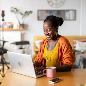 a woman smiling while working